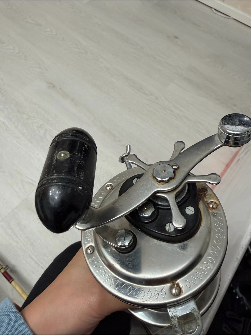 Vintage Silver Fishing Reel with Black Handle - Men Accessories